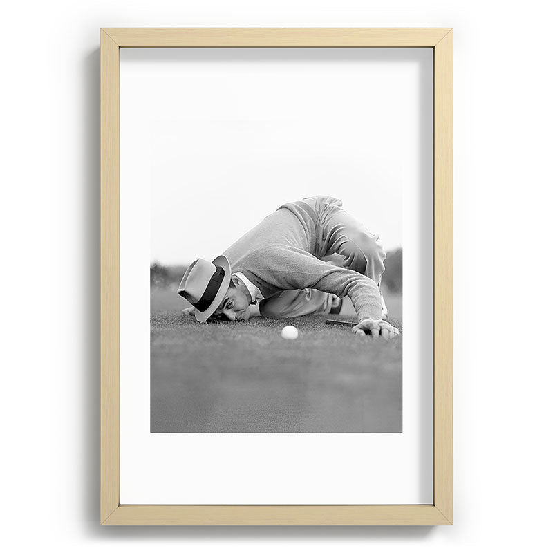Eye to the ground on the 18th hole; golfing man eyes ball to measure distance to hole vintage black and white portrait photograph - photography - photographs poster Framed Art Print Gallery Image 97
