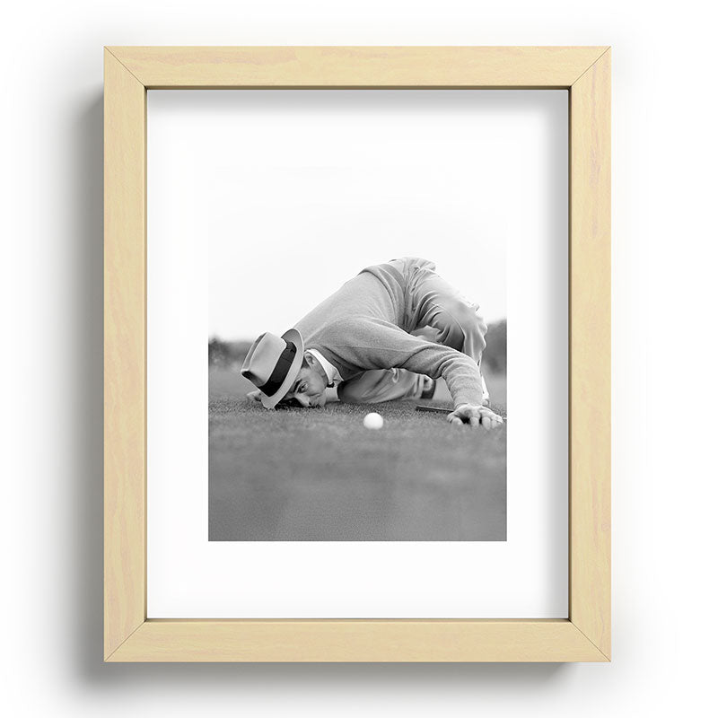 Eye to the ground on the 18th hole; golfing man eyes ball to measure distance to hole vintage black and white portrait photograph - photography - photographs poster Framed Art Print Gallery Image 95