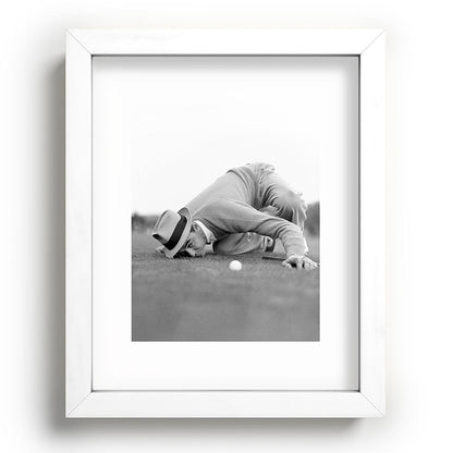 Eye to the ground on the 18th hole; golfing man eyes ball to measure distance to hole vintage black and white portrait photograph - photography - photographs poster Framed Art Print Gallery Image 104