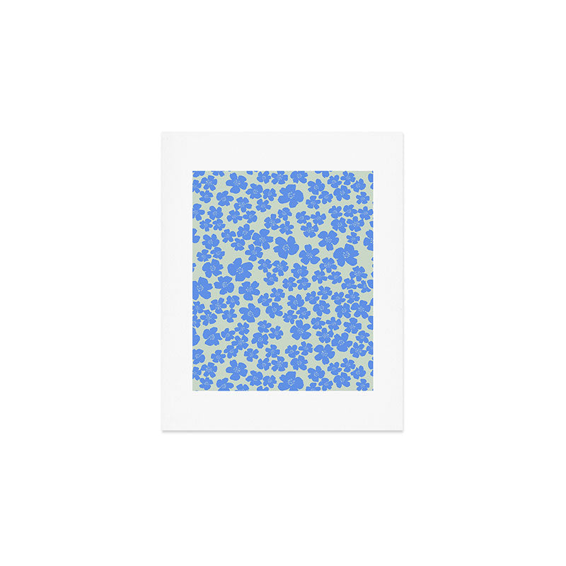 Blue flower blossom scatter on soft green Art Print Gallery Image 1
