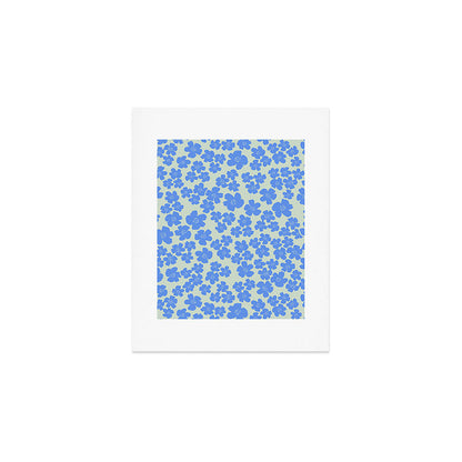 Blue flower blossom scatter on soft green Art Print Gallery Image 1